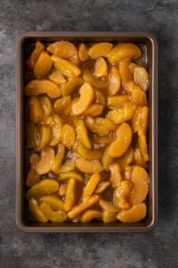 Apple pie filling in a baking pan.