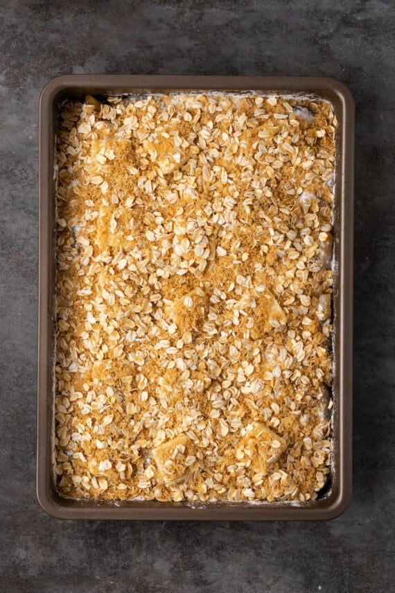 Assembled apple dump cake in a baking pan.