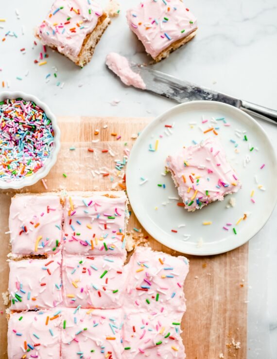 Cake Batter Blondies topped with frosting and sprinkles