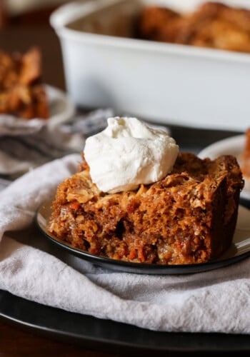 Carrot Cake Earthquake Cake on a plate with whipped cream