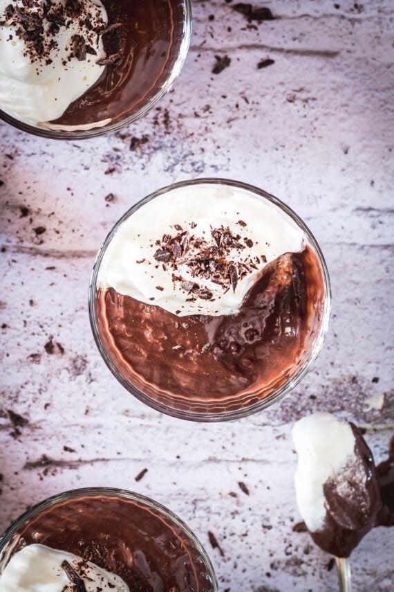 Bowl of pudding with whipped cream.