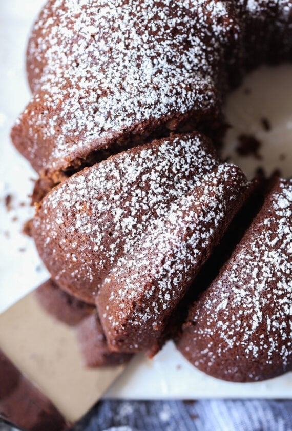 A Slice of Chocolate Pound Cake Topped with Powdered Sugar