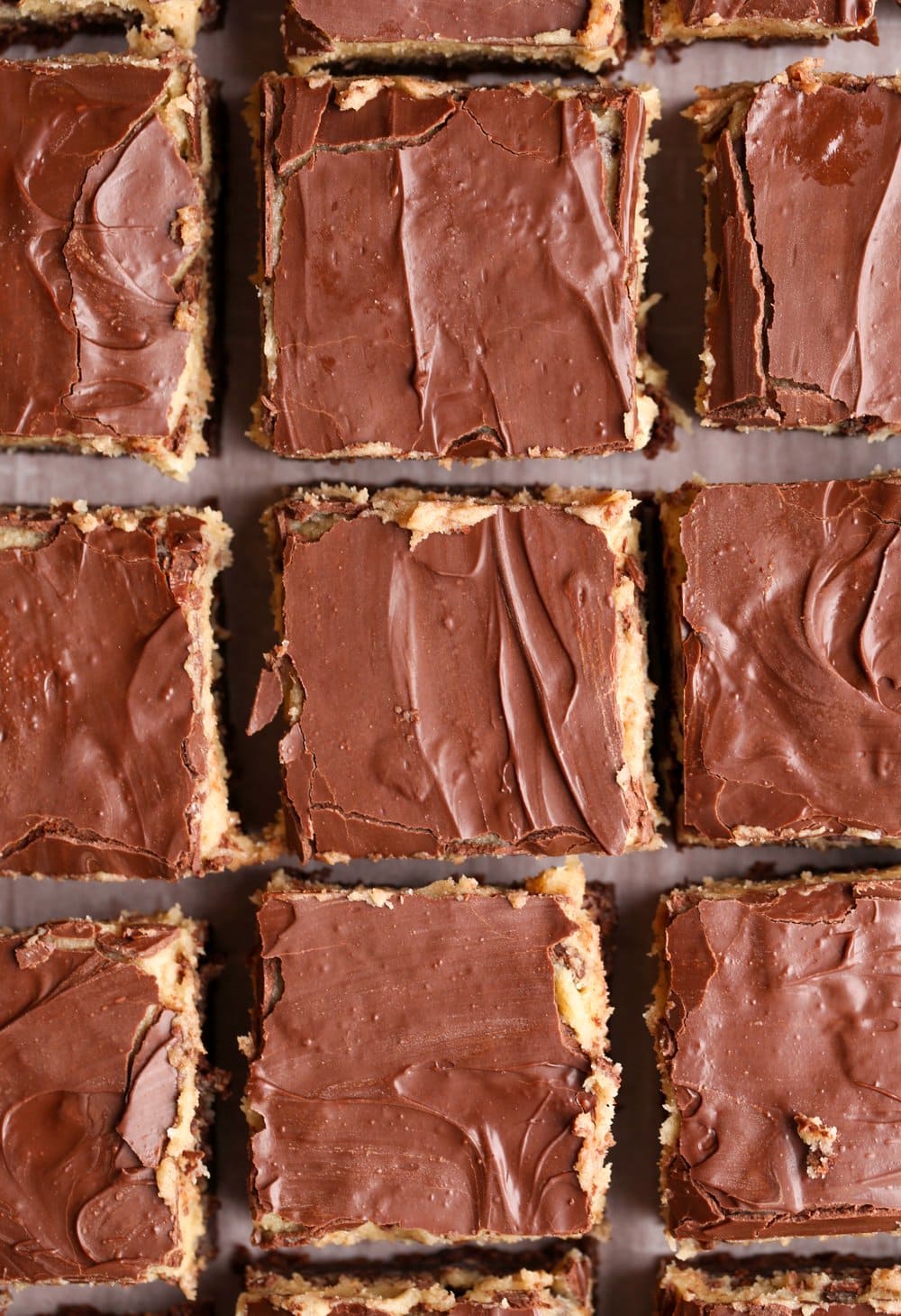 Brownies shot from above topped with chocolate ganache