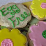 Overhead view of eggless sugar cookies decorated like flowers