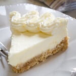 A slice of lemon cream pie on a plate.