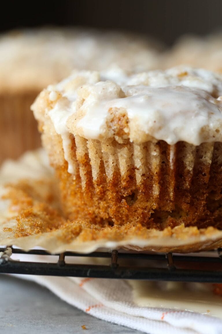 Close up of a pumpkin apple muffin with glaze.