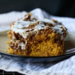 A slice of Pumpkin Cinnamon Roll Cake on a plate