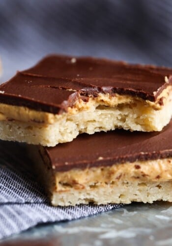 Tagalong Bars are a homemade version of the classic Girl Scout Cookie...a buttery shortbread crust, with a sweet, creamy peanut butter filling, topped with rich chocolate. A fun twist on the original!