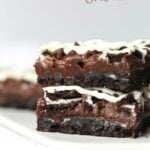 Triple Chocolate Oreo Bars...A creamy fudge layer that sits on top of a crunchy Oreo crust, topped with chocolate chips, MORE Oreos and white chocolate!