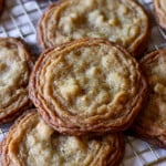 pan banging walnut cookies on a wire rack